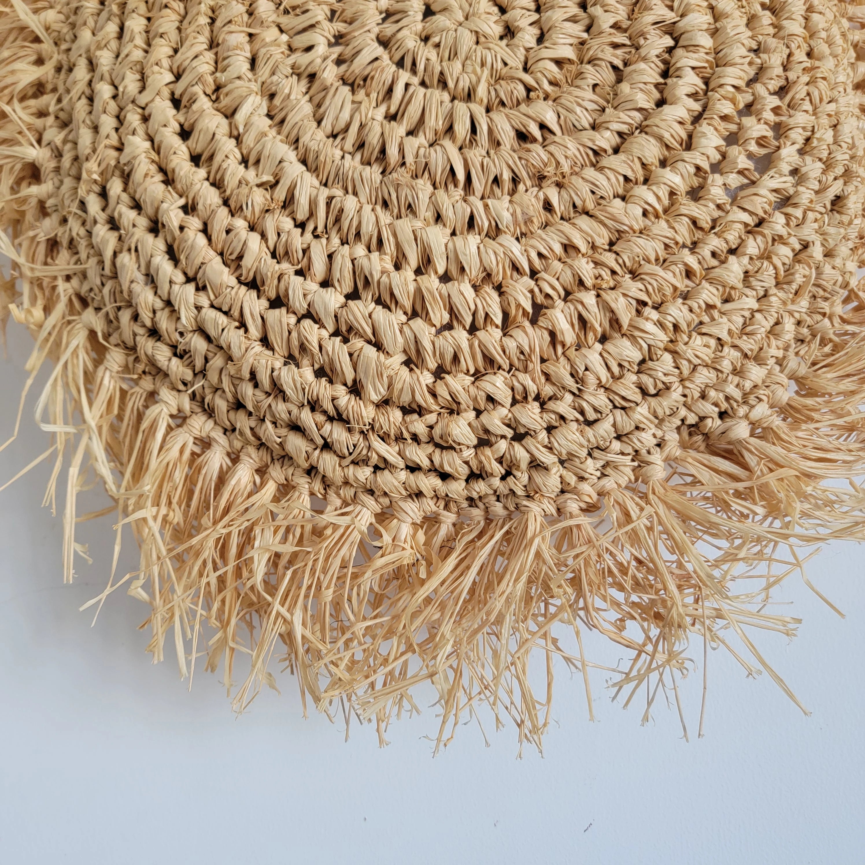 Coussin décoratif bohème rond en raphia