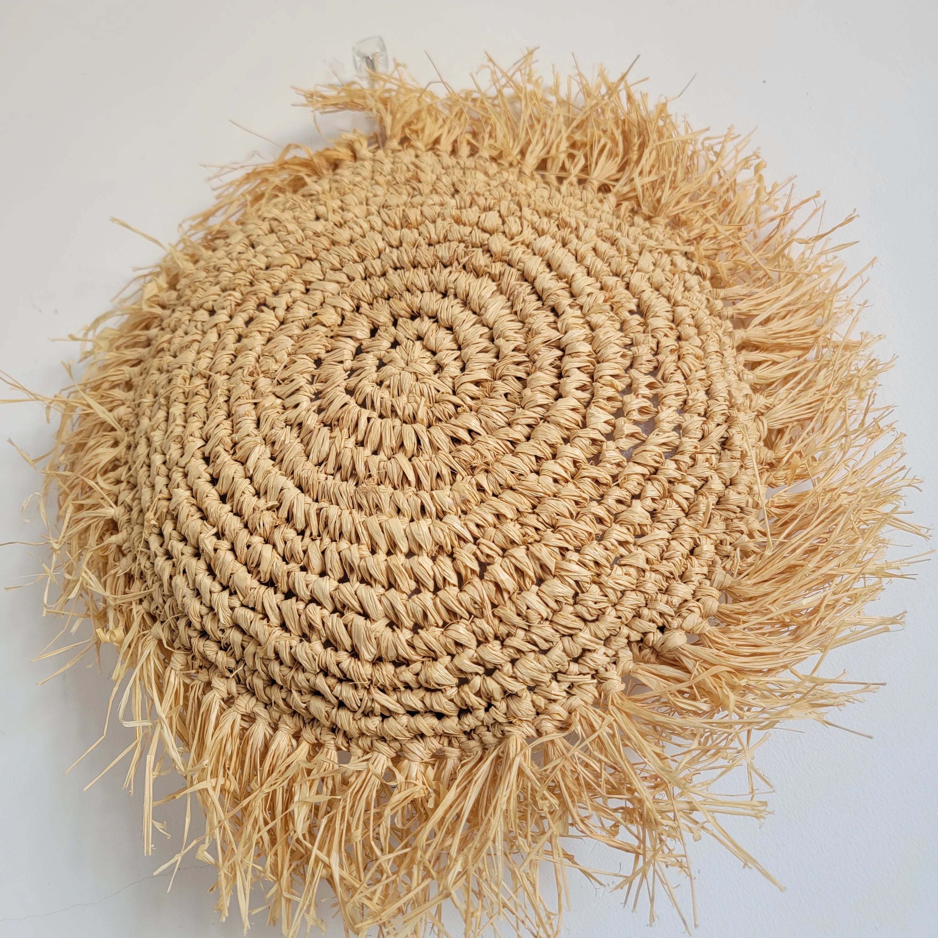 Coussin décoratif bohème rond en raphia