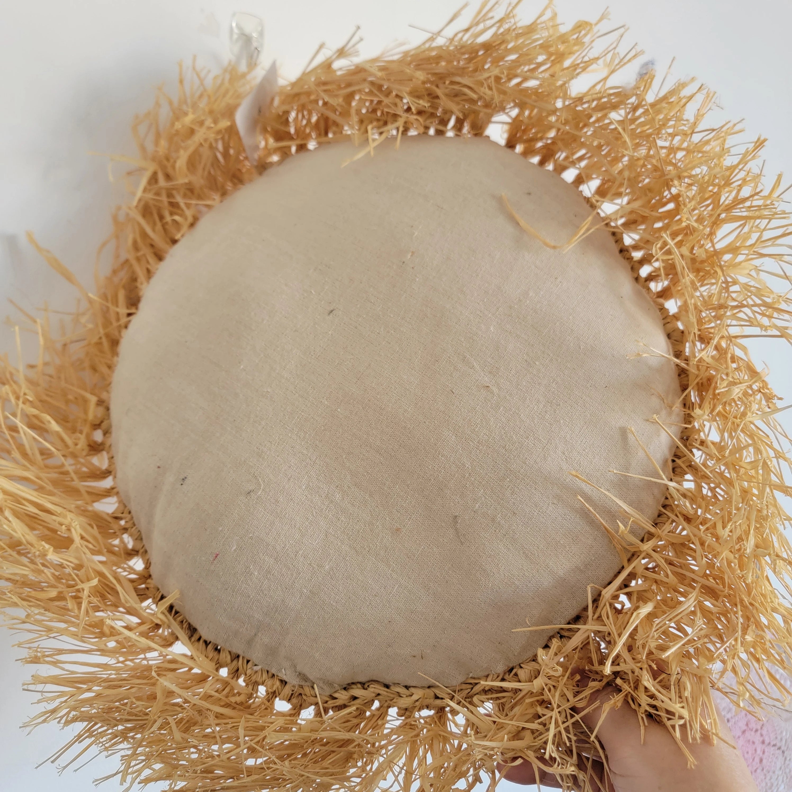 Coussin décoratif bohème rond en raphia
